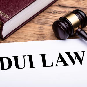 DUI law text on white paper and representing driving under the influence on private property